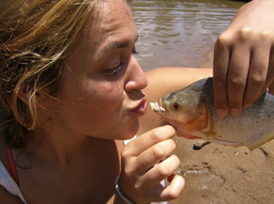 Kim kissing a piranha